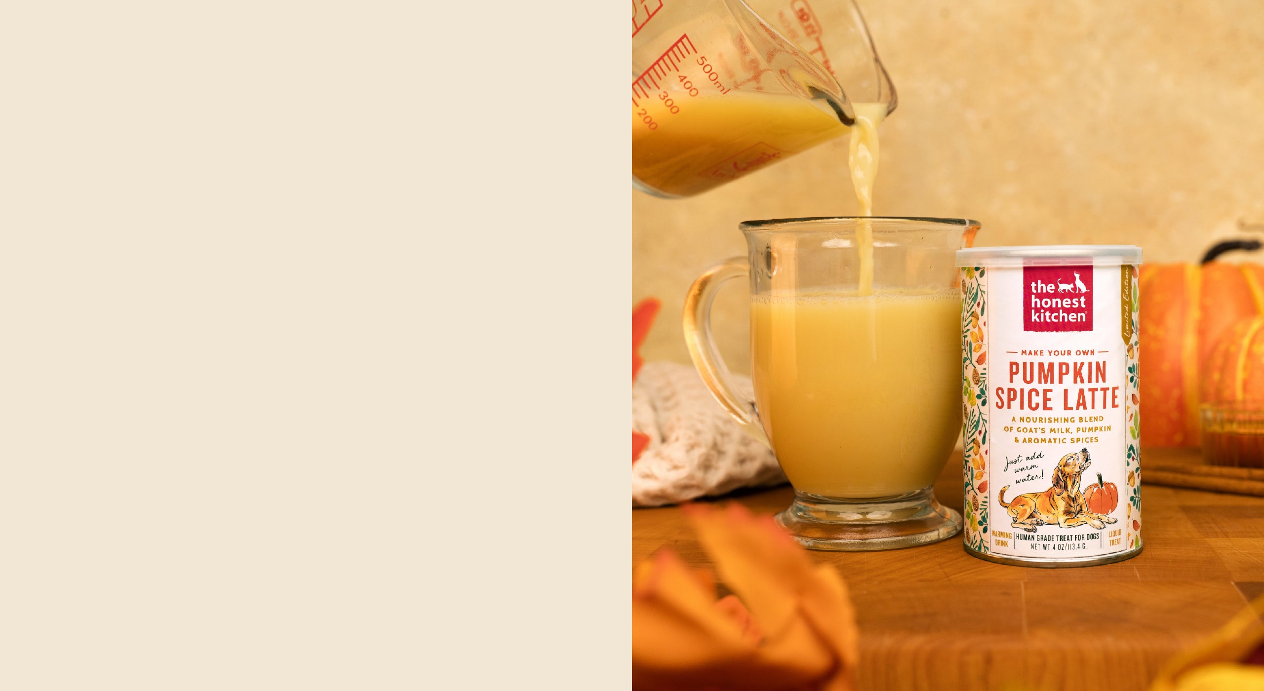 Pumpkin spice latte being poured into a glass with a can of pumpkin spice latte mix on a wooden surface. Healthy, high quality, human grade food for dogs and cats from The Honest Kitchen.