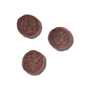 3 pieces of brown dry cat food. Whole Food Clusters dry cat food from The Honest Kitchen.